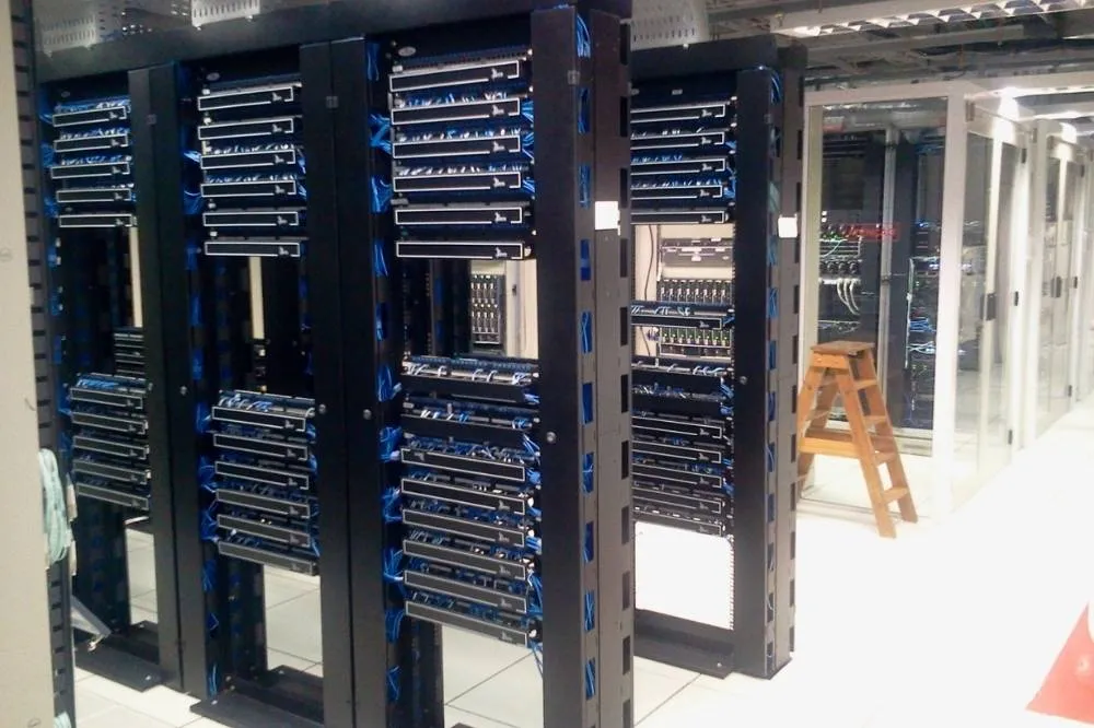 A server tower being operated on by managed IT professionals.