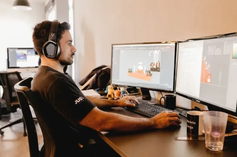 A managed It expert works at a computer terminal in a client's office.